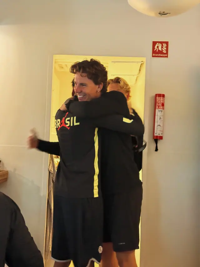 A hug in the doorway