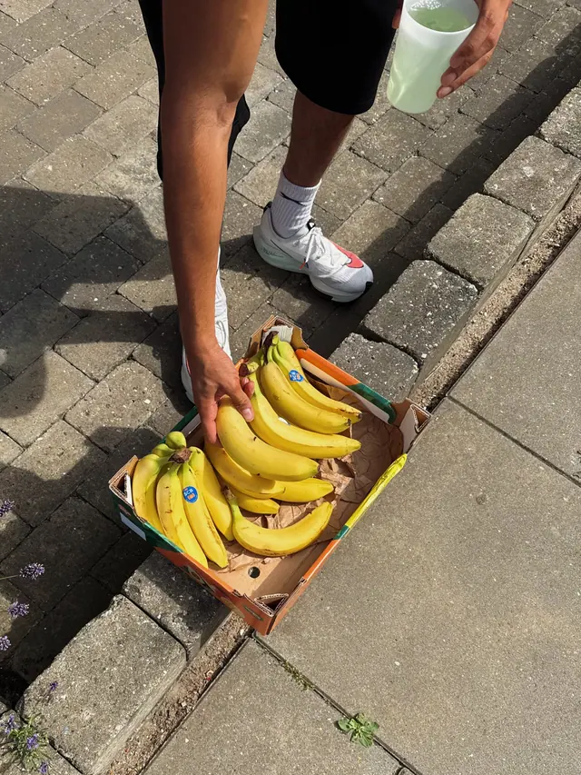 A box of bananas on the kerb