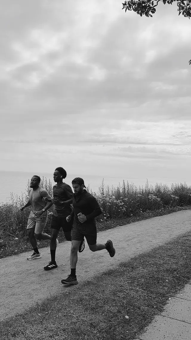 Two runners on a quiet path, black and white