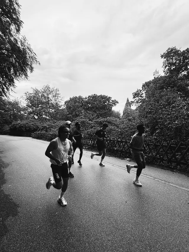 A group running, black and white