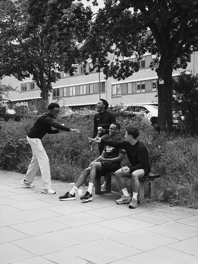 A group talking on a bench