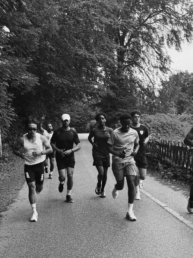 A pack of runners on an open road