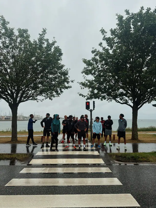 The group crossing by the water