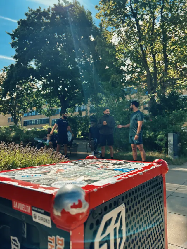 Hands holding paper coffee cups after a run