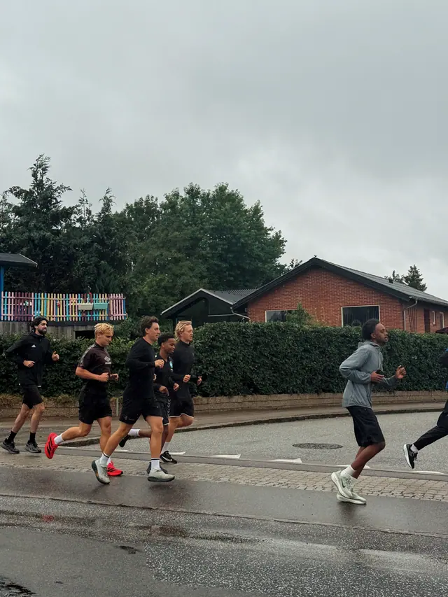 A group running on a wet road