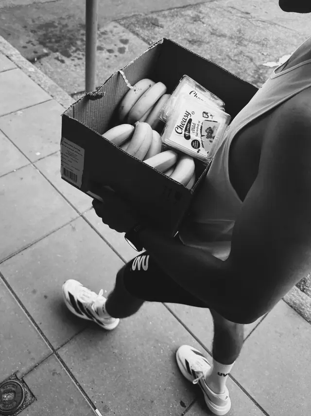 Carrying a box of supplies to the meeting point
