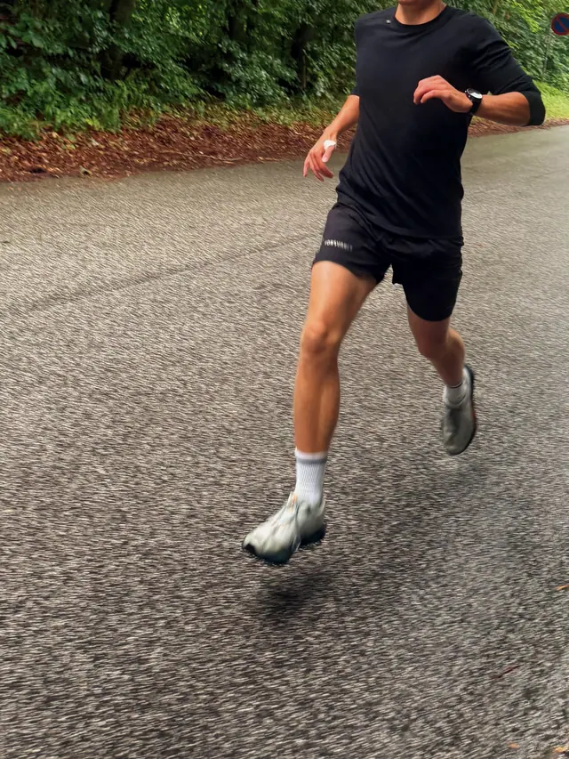 A runner on wet asphalt